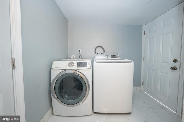 clothes washing area featuring washing machine and clothes dryer