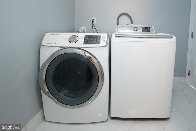 washroom with washer and clothes dryer