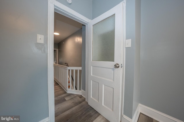 corridor featuring wood-type flooring