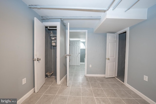 corridor featuring light tile patterned floors