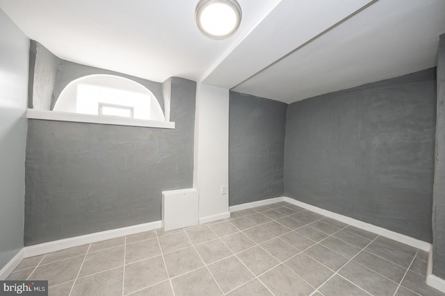 bonus room featuring tile patterned flooring