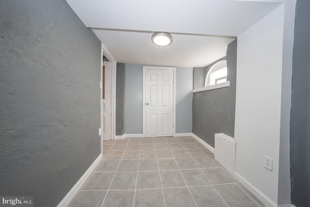 hallway with light tile patterned flooring