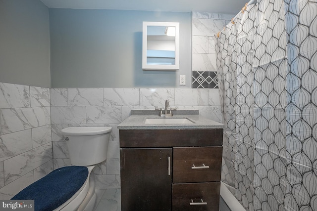 bathroom featuring a shower with curtain, vanity, toilet, and tile walls