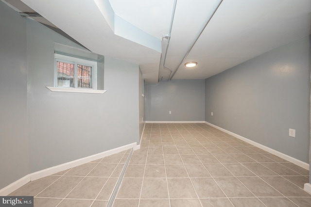 basement with light tile patterned flooring