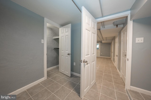 corridor featuring tile patterned flooring