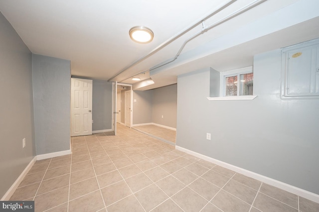 basement featuring light tile patterned floors