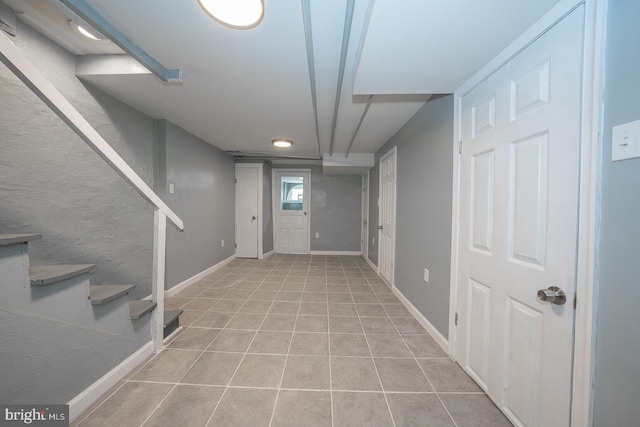 basement with light tile patterned floors