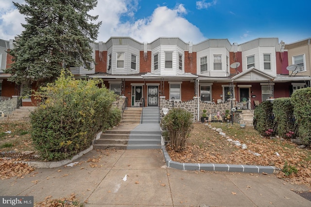 multi unit property featuring covered porch