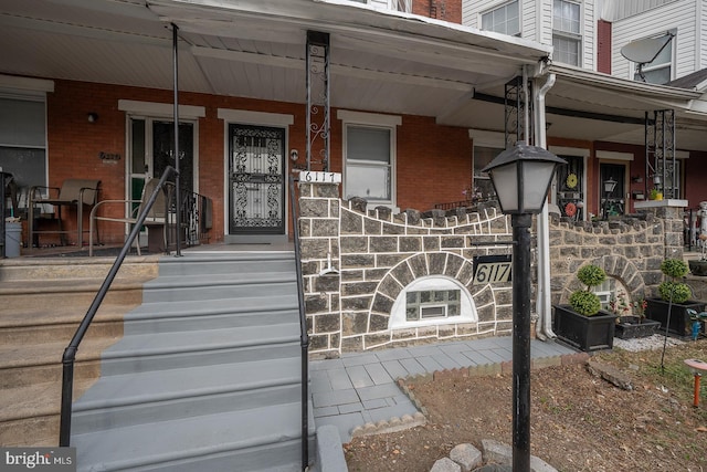 doorway to property featuring covered porch