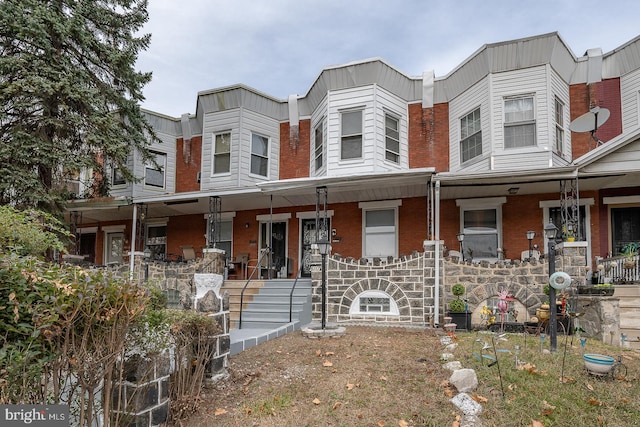 view of property with a porch