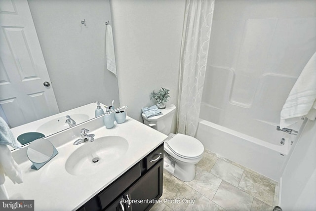 full bathroom featuring toilet, vanity, and shower / bathtub combination with curtain