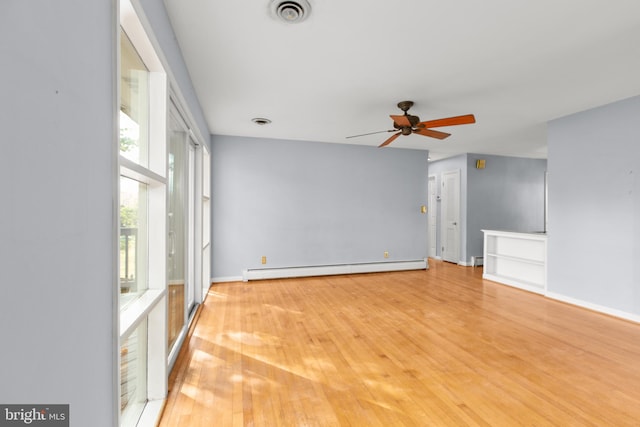 unfurnished living room with ceiling fan, baseboard heating, and light hardwood / wood-style floors