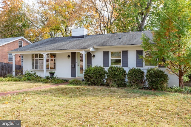 ranch-style home featuring a front yard