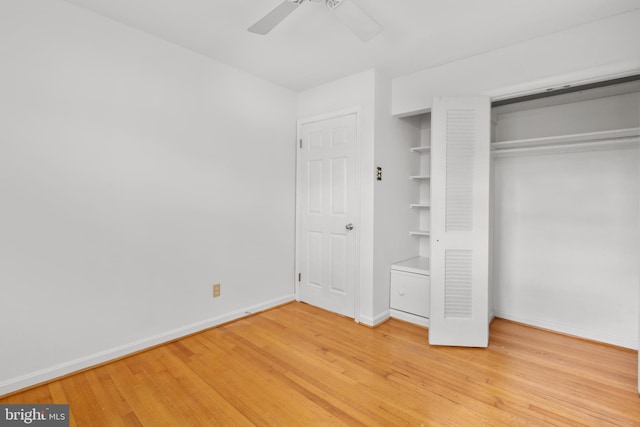 unfurnished bedroom with hardwood / wood-style floors, ceiling fan, and a closet