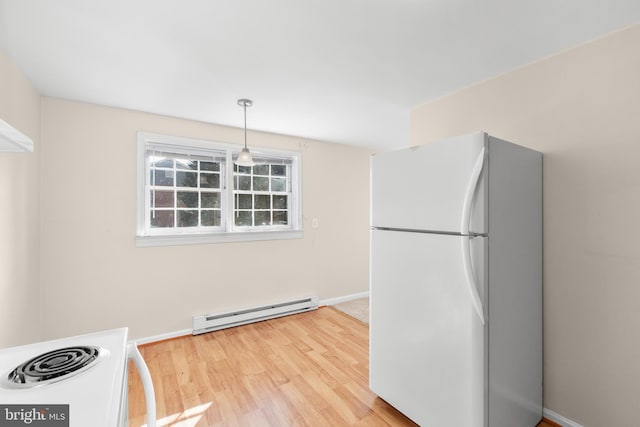 kitchen featuring pendant lighting, a baseboard radiator, white appliances, and light hardwood / wood-style flooring