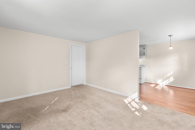 empty room with light hardwood / wood-style floors