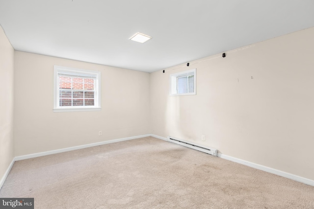 carpeted empty room with a baseboard radiator