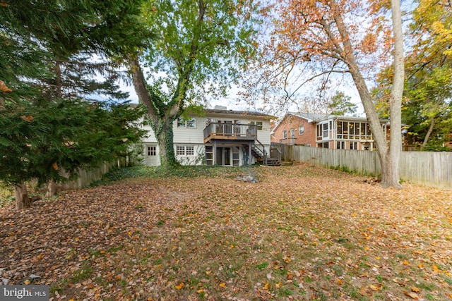 view of yard with a wooden deck