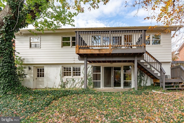 rear view of house with a wooden deck