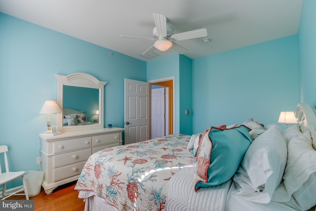 bedroom featuring ceiling fan and hardwood / wood-style floors