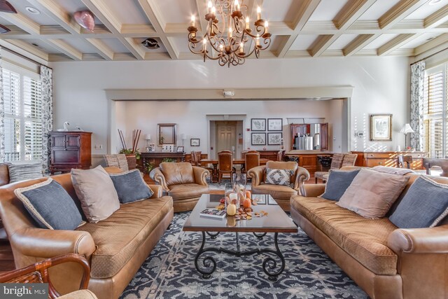 living room with beam ceiling, a chandelier, and coffered ceiling