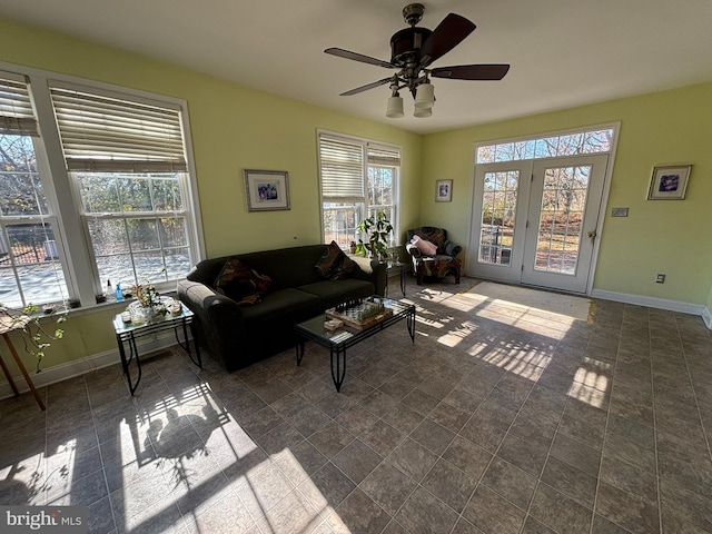 living room featuring a wealth of natural light and ceiling fan