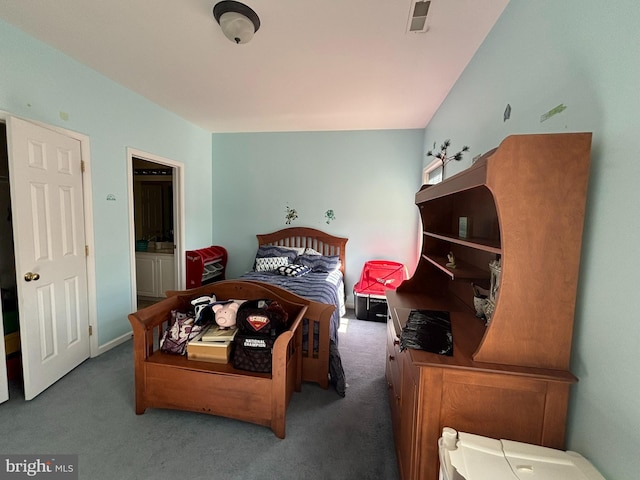 carpeted bedroom featuring ensuite bathroom