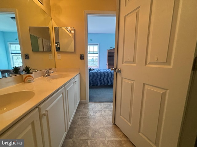 bathroom with vanity and tile patterned flooring