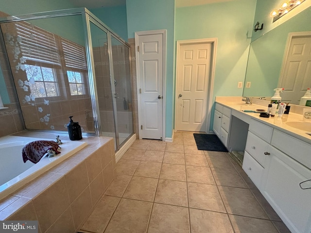 bathroom with independent shower and bath, vanity, and tile patterned flooring