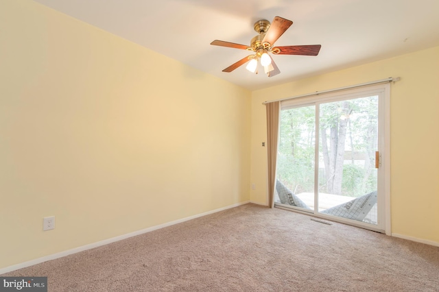 spare room with carpet flooring and ceiling fan