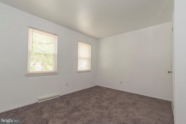 carpeted spare room featuring a healthy amount of sunlight