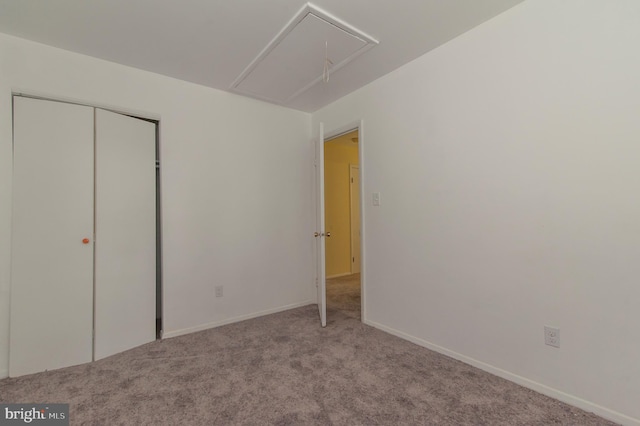 unfurnished bedroom featuring light carpet