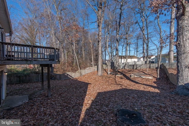 view of yard with a wooden deck