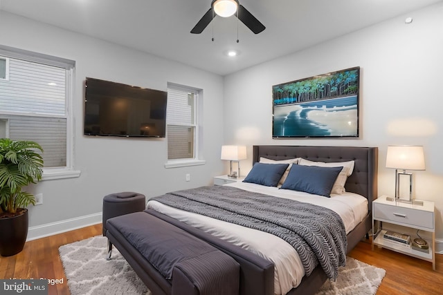 bedroom featuring wood-type flooring and ceiling fan