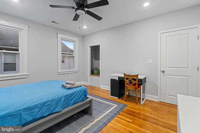 bedroom featuring wood-type flooring and ceiling fan