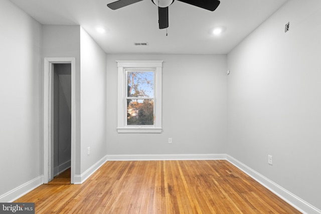 empty room featuring ceiling fan and light wood-type flooring