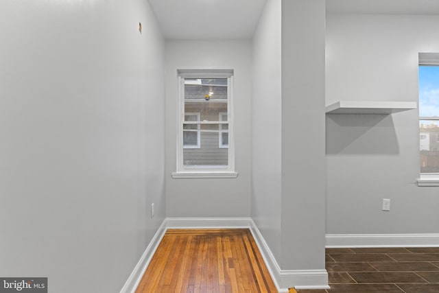 hall with dark wood-type flooring