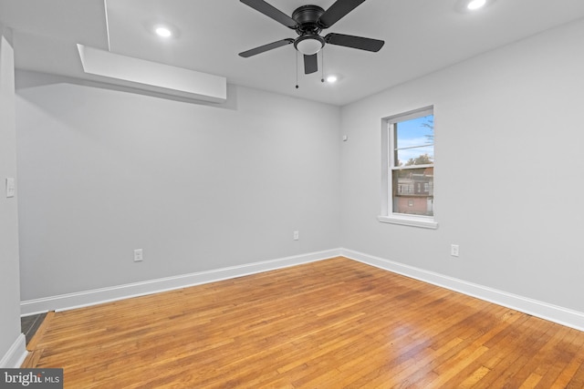 unfurnished room with wood-type flooring and ceiling fan