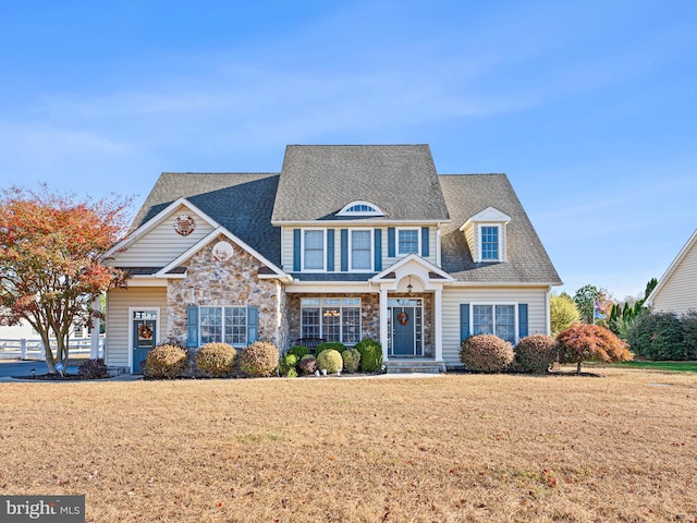 view of front of property with a front lawn