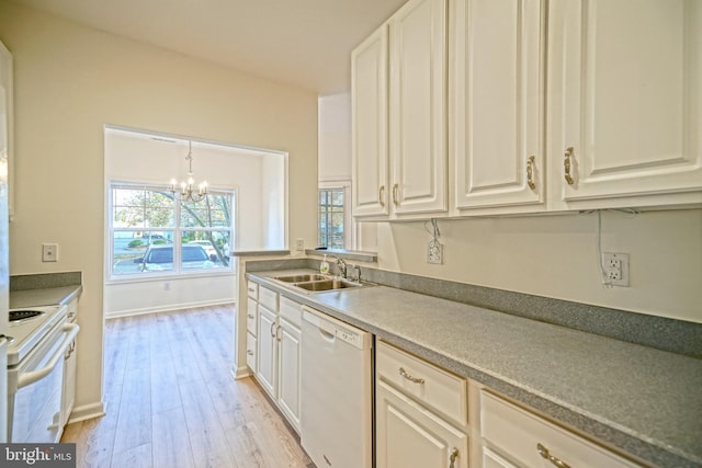 kitchen featuring white cabinets, light hardwood / wood-style floors, sink, and white appliances