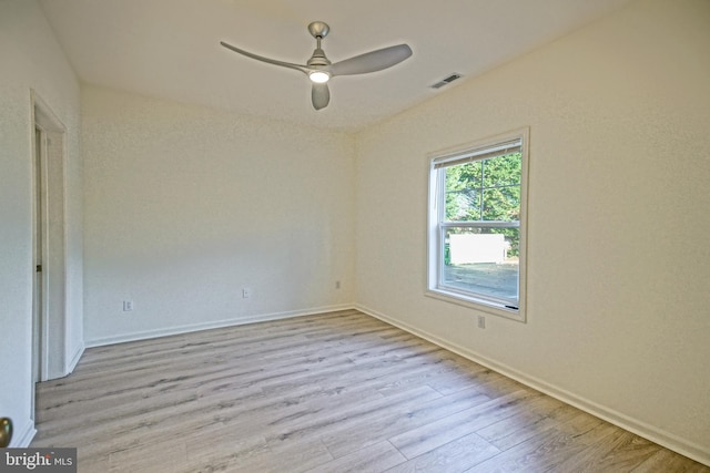 empty room with light wood-type flooring and ceiling fan