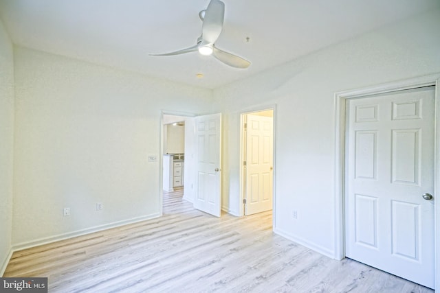 unfurnished bedroom featuring ceiling fan and light wood-type flooring