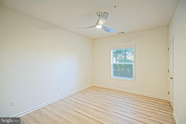 unfurnished room featuring light hardwood / wood-style floors and ceiling fan