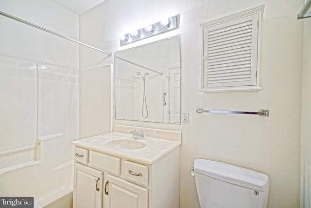 bathroom with toilet and vanity