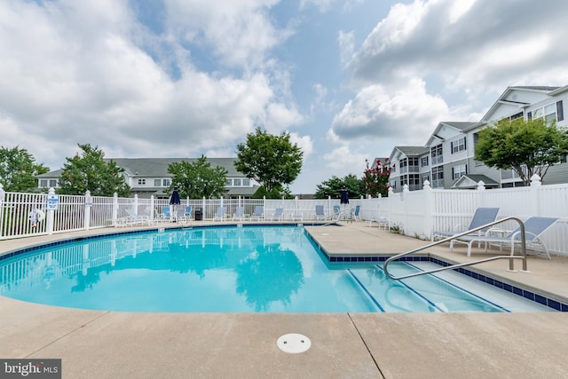 view of swimming pool with a patio area