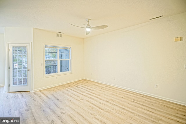 unfurnished room with ceiling fan and light hardwood / wood-style flooring