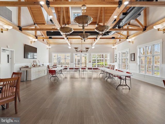 game room with high vaulted ceiling, hardwood / wood-style flooring, and beamed ceiling