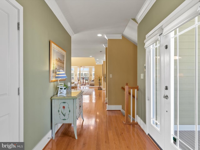 hallway featuring crown molding and light wood-type flooring