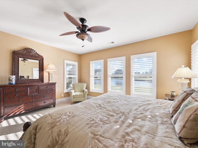 bedroom featuring ceiling fan and light colored carpet