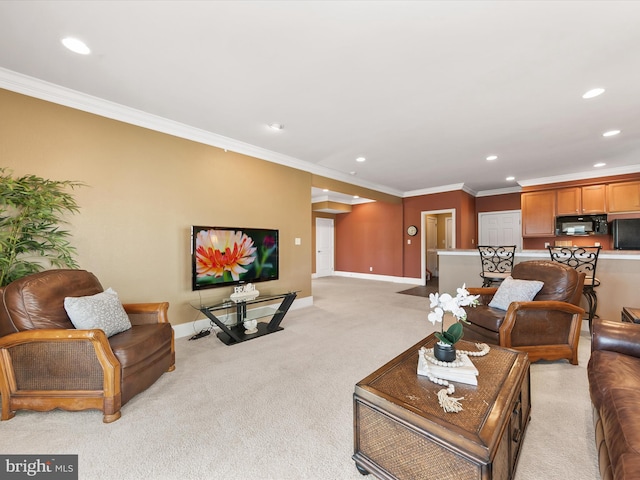 carpeted living room with ornamental molding